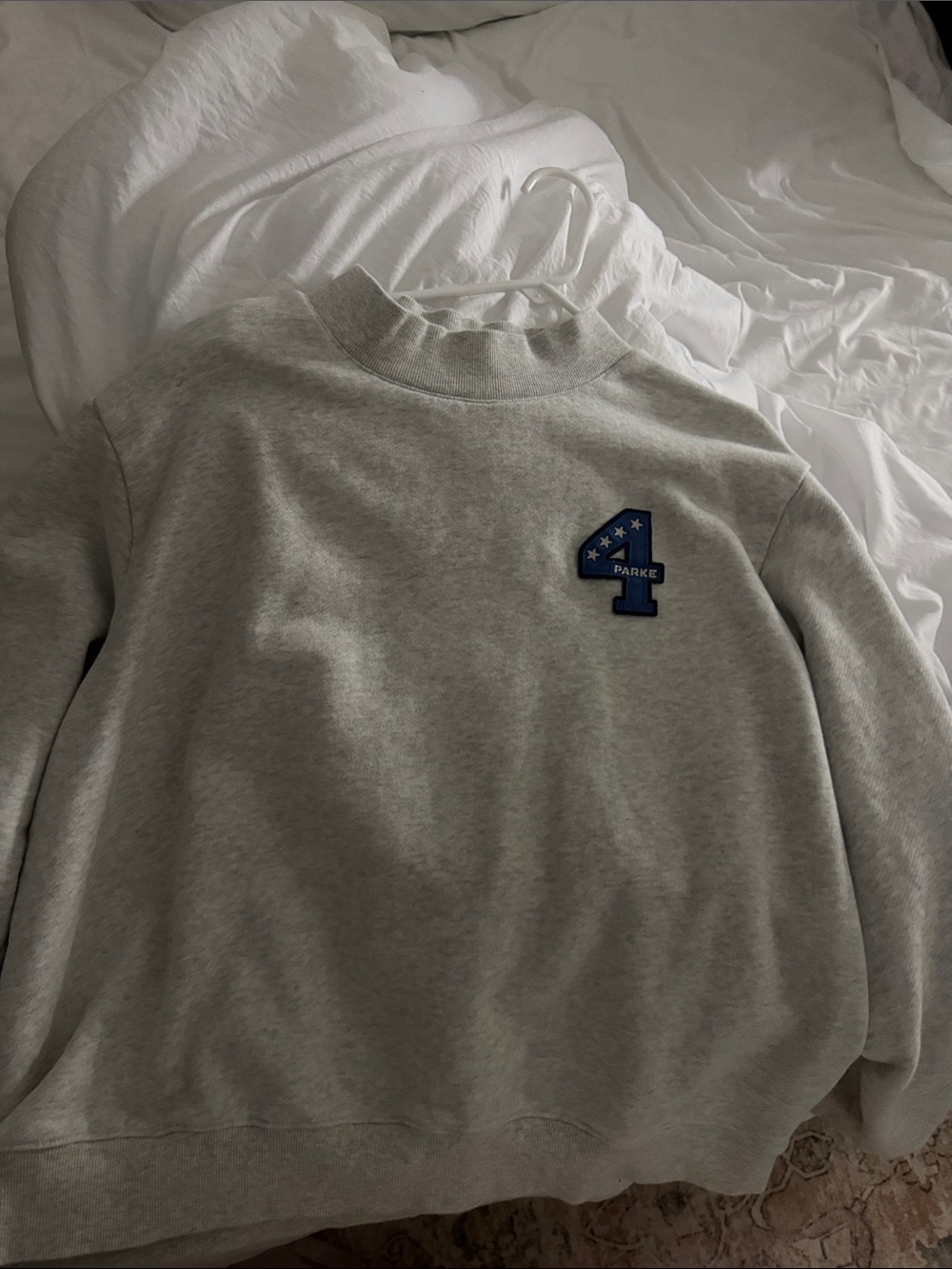 Light Gray Crewneck Sweater with Blue '4' Emblem